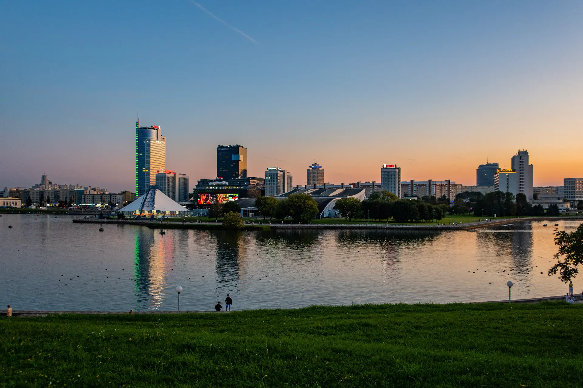 The Minsk skyline near Niamiha, towers catching the last light of evening.